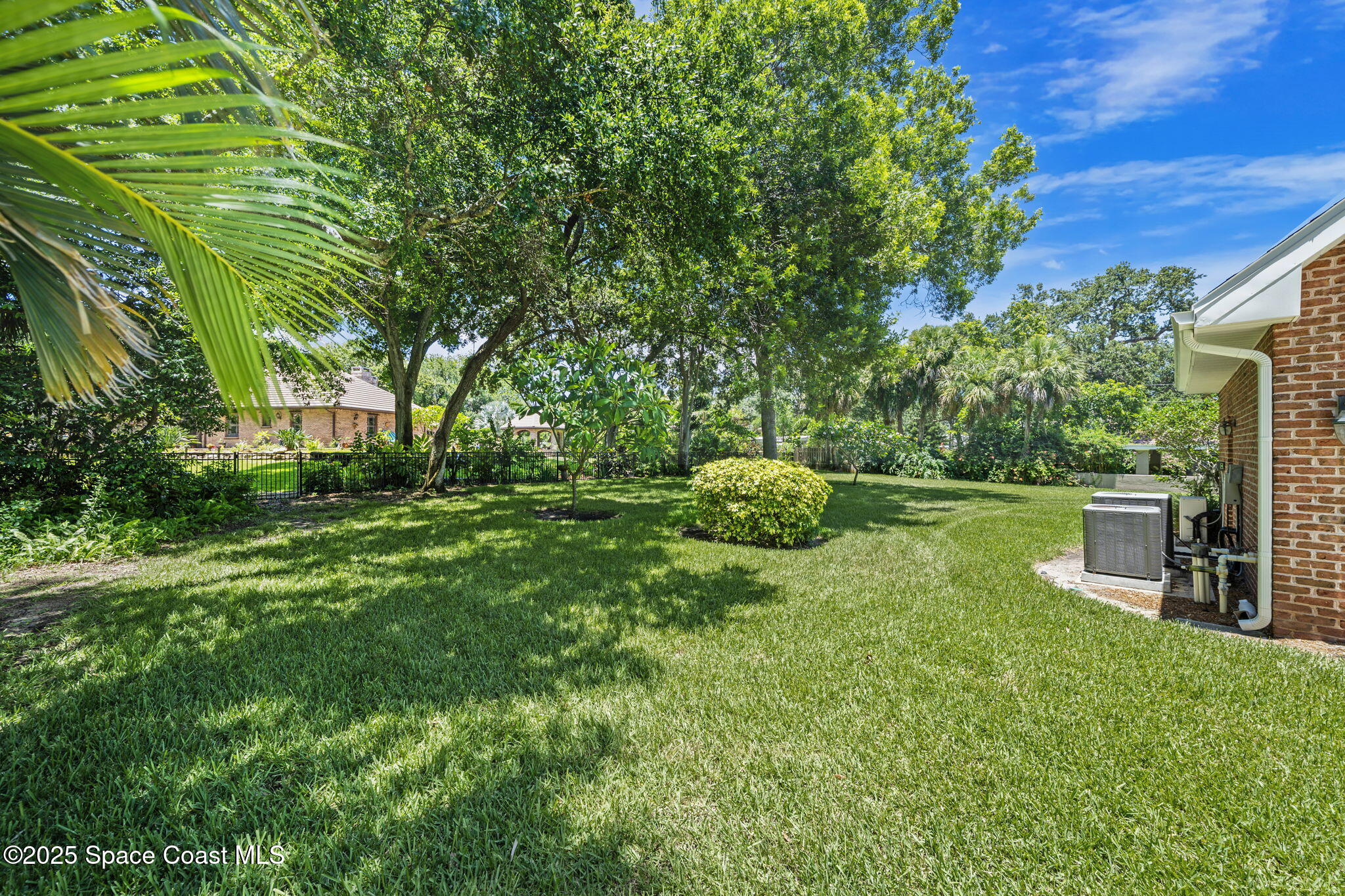 1407 Rockledge Drive Rockledge, FL 32955 - Photo 27 of 79 a view of backyard with table and chairs and potted plants