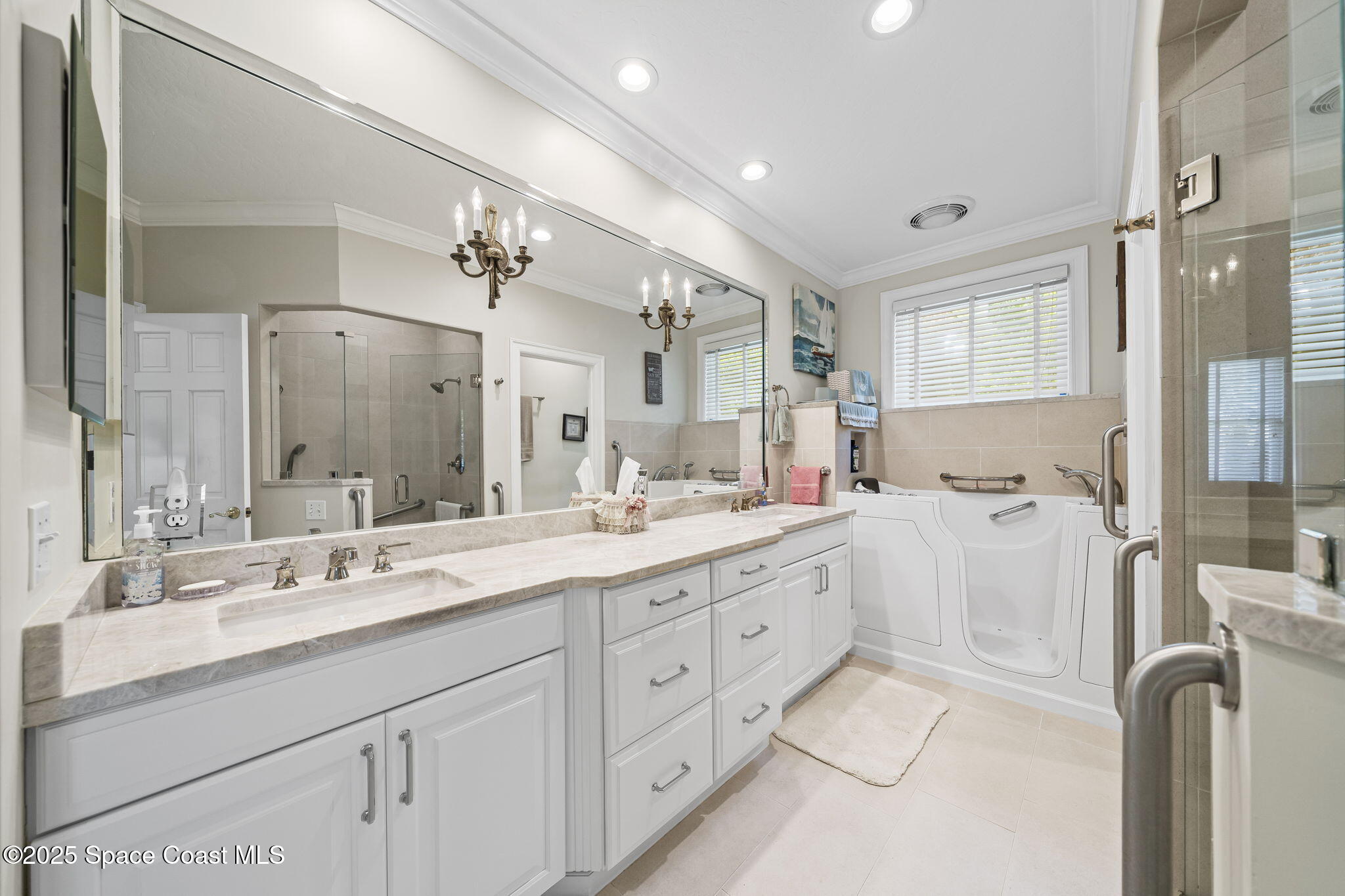1407 Rockledge Drive Rockledge, FL 32955 - Photo 5 of 79 a spacious bathroom with a double vanity sink mirror and double