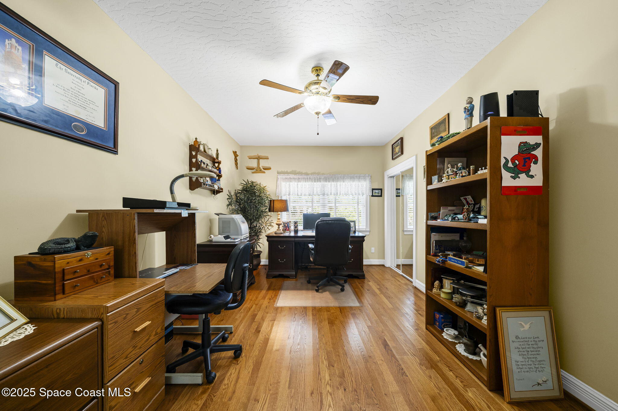 1407 Rockledge Drive Rockledge, FL 32955 - Photo 6 of 79 a living room with furniture a flat screen tv and a fireplace