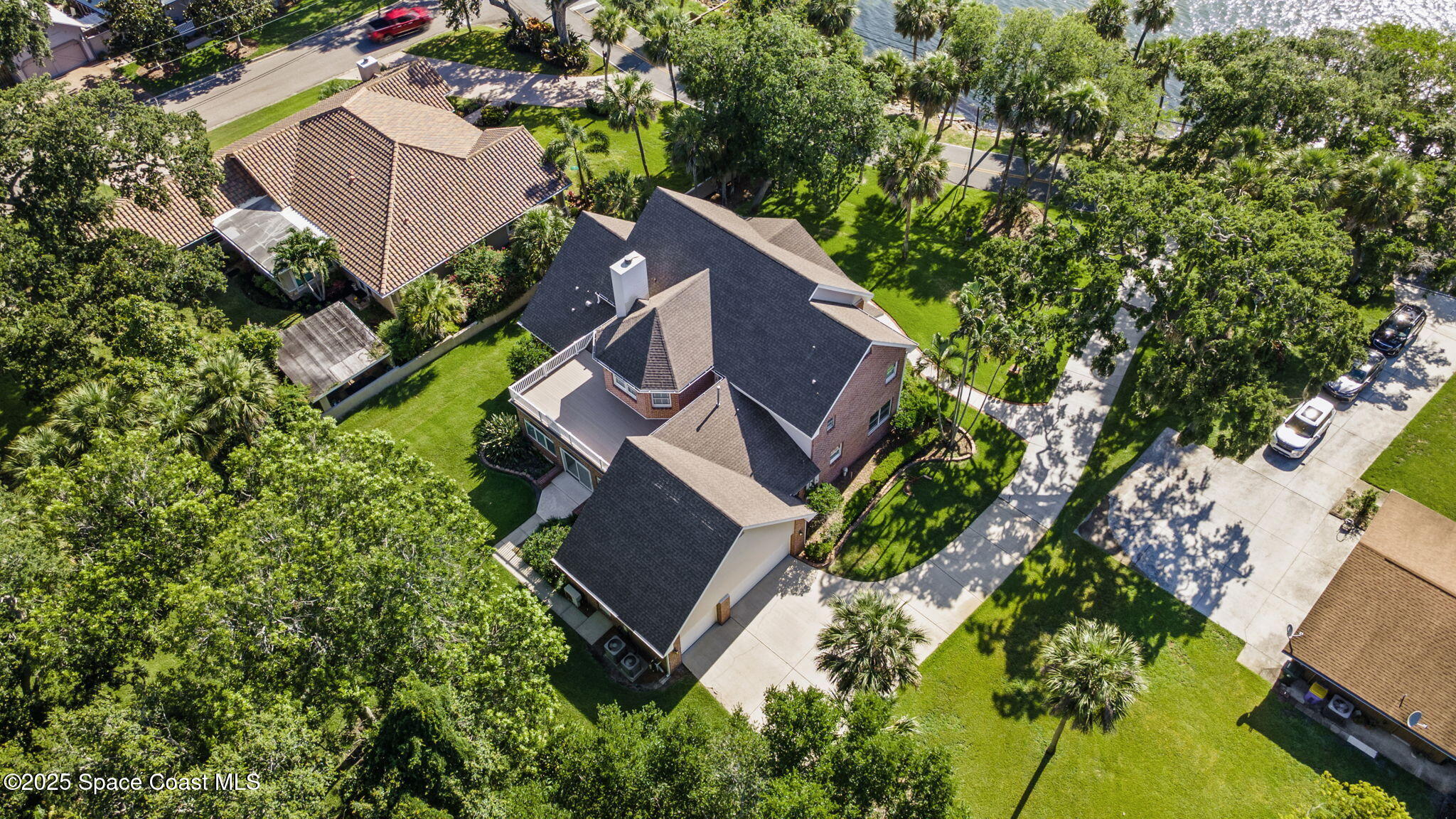 1407 Rockledge Drive Rockledge, FL 32955 - Photo 62 of 79 an aerial view of a house with a yard and trees