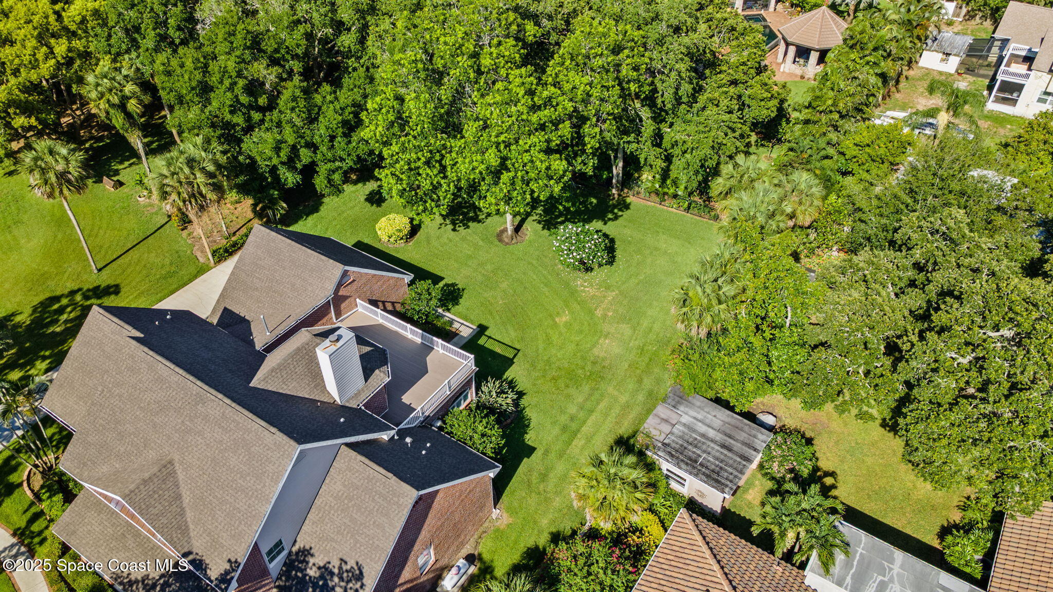 1407 Rockledge Drive Rockledge, FL 32955 - Photo 63 of 79 an aerial view of a house with a yard basket ball court and outdoor seating
