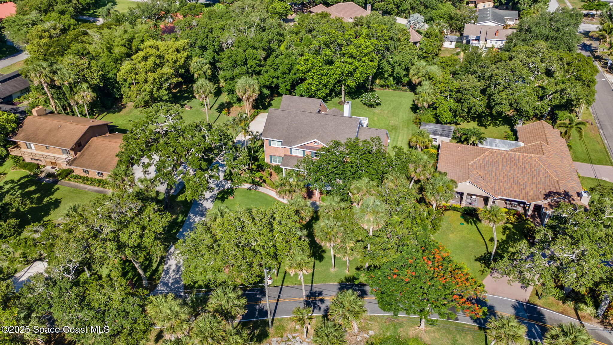 1407 Rockledge Drive Rockledge, FL 32955 - Photo 76 of 79 an aerial view of residential house with outdoor space and trees all around