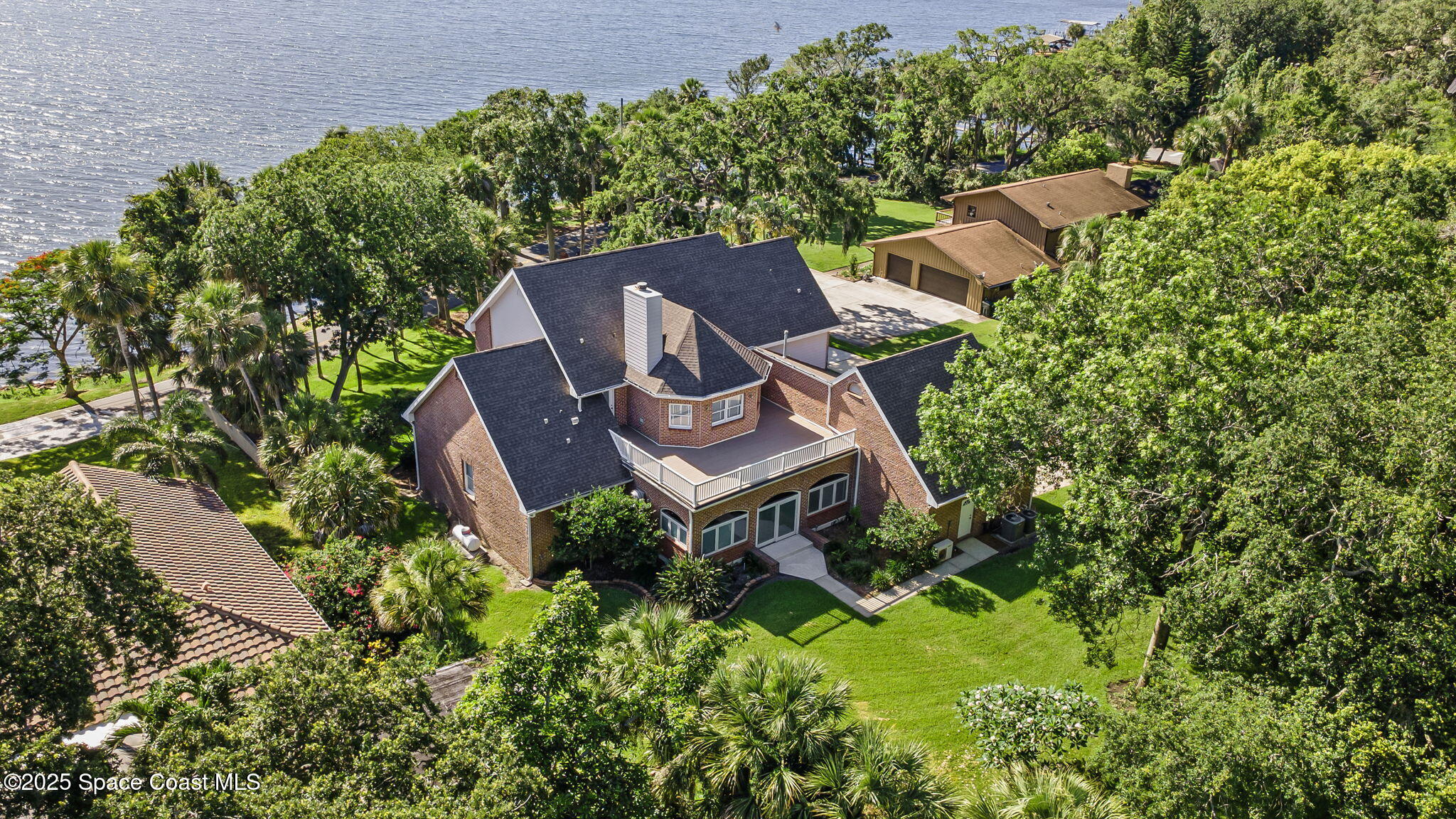 1407 Rockledge Drive Rockledge, FL 32955 - Photo 77 of 79 an aerial view of a house with a yard