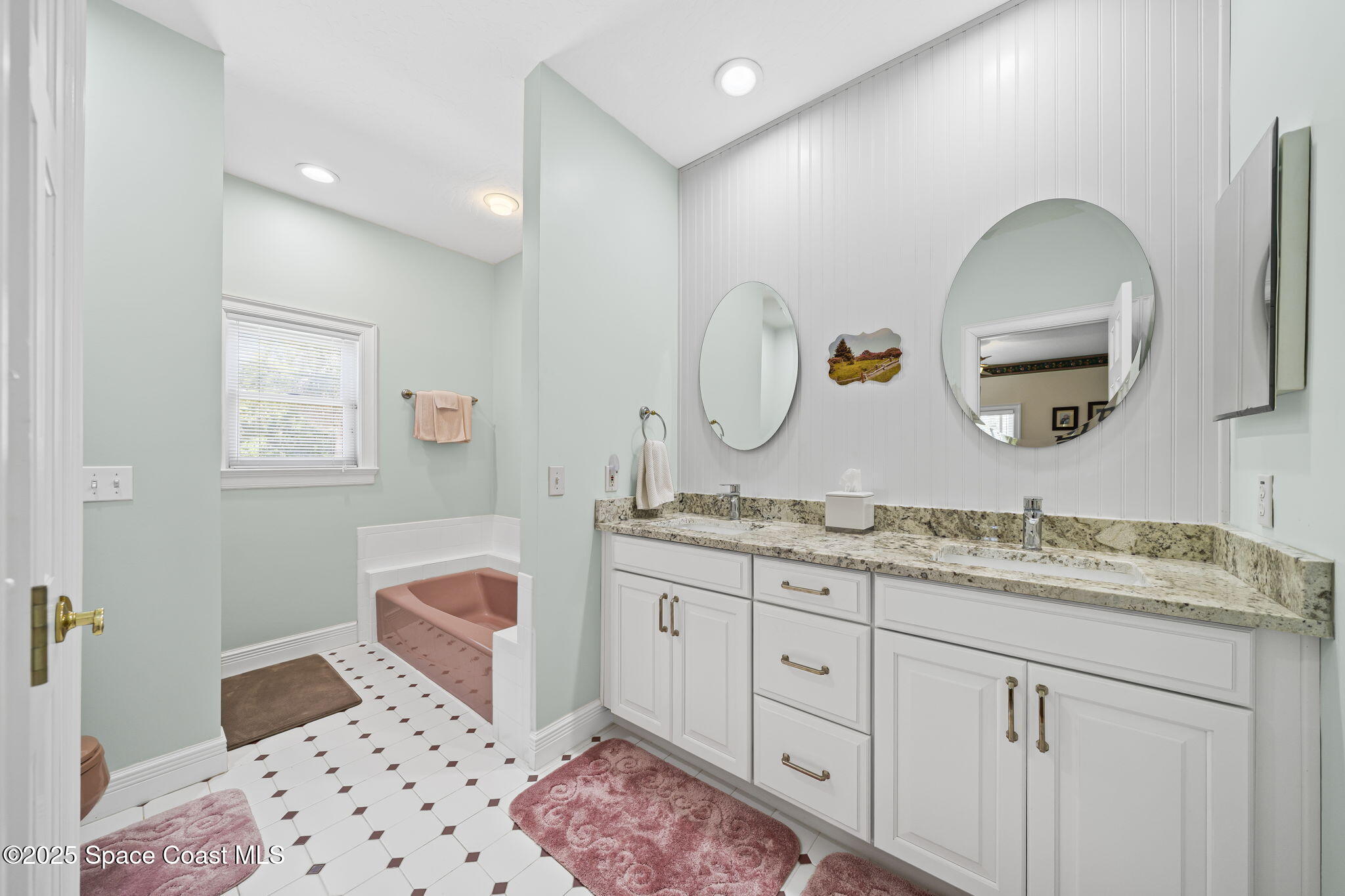 1407 Rockledge Drive Rockledge, FL 32955 - Photo 9 of 79 a spacious bathroom with a granite countertop sink a mirror and a