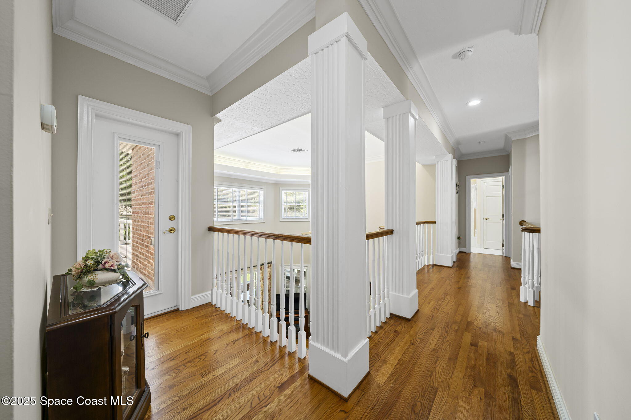1407 Rockledge Drive Rockledge, FL 32955 - Photo 10 of 79 a view of a hallway with wooden floor and a living room