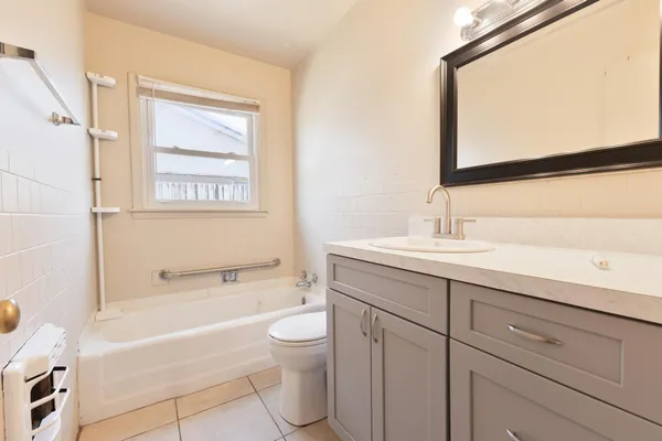 a bathroom with a sink a toilet and bathtub