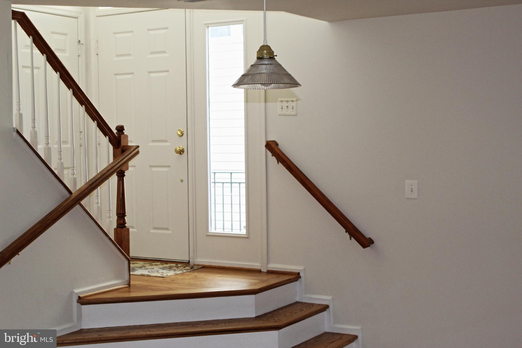 43497 Interval Street Chantilly, VA 20152 - Photo 10 of 19 Foyer with new hardwood floor and stairs