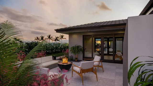 a outdoor space with patio lots of flowers and umbrella