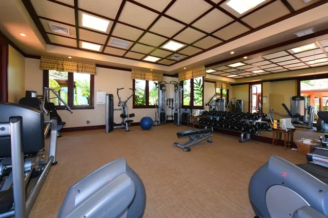 a room with lots of furniture and a chandelier