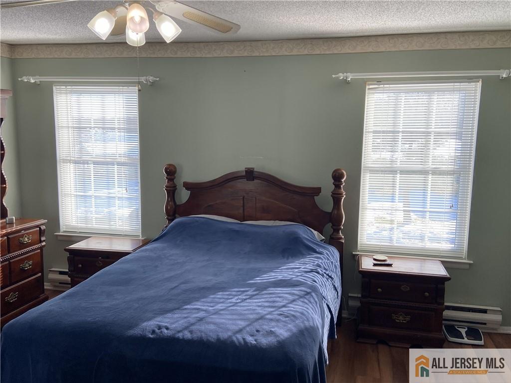 525 Belford Road, Unit O Monroe Township, NJ 08831 - Photo 11 of 19 a bedroom with a bed and a window
