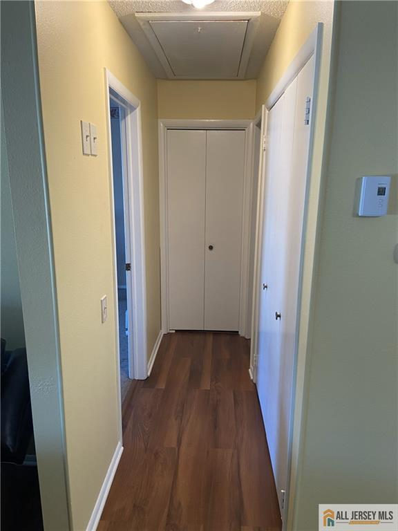 525 Belford Road, Unit O Monroe Township, NJ 08831 - Photo 15 of 19 a view of a hallway with wooden floor