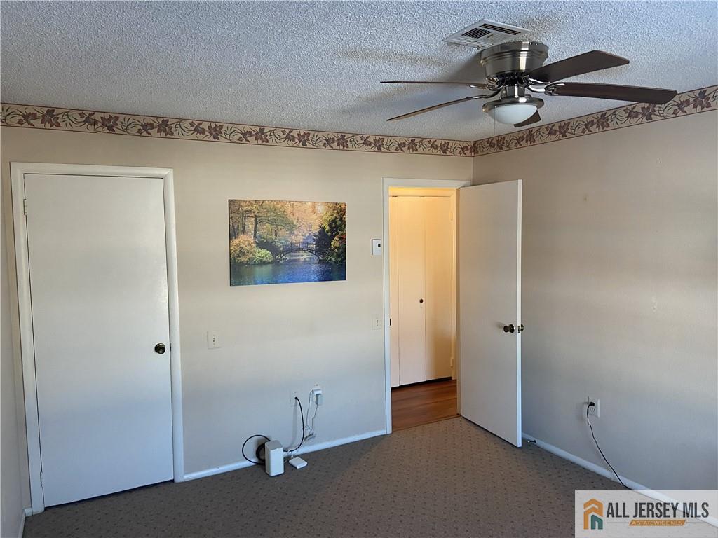 525 Belford Road, Unit O Monroe Township, NJ 08831 - Photo 17 of 19 a view of a hallway with a fan
