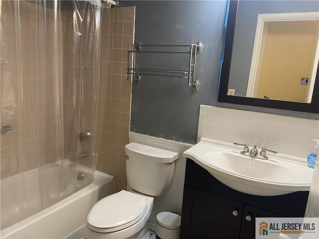 525 Belford Road, Unit O Monroe Township, NJ 08831 - Photo 18 of 19 a bathroom with a sink a toilet and shower