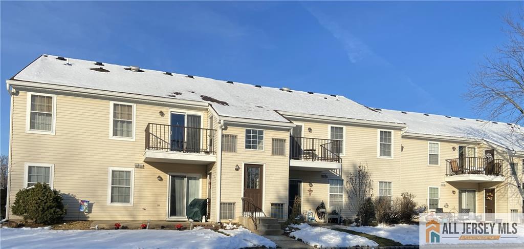 525 Belford Road, Unit O Monroe Township, NJ 08831 - Photo 19 of 19 a large building with a outdoor space