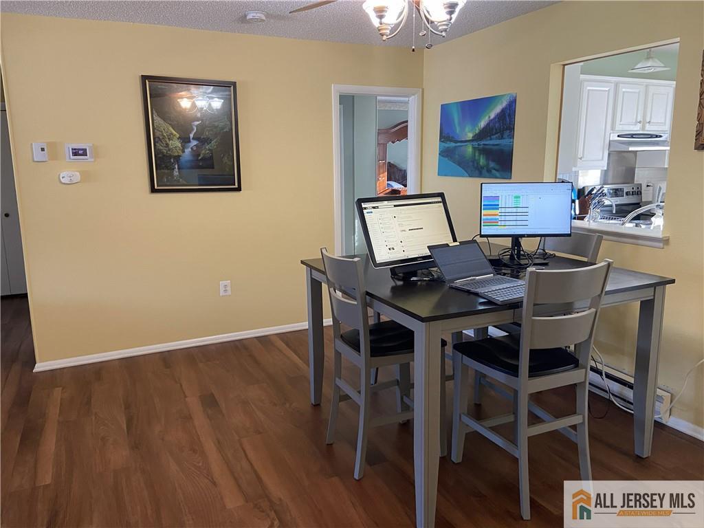 525 Belford Road, Unit O Monroe Township, NJ 08831 - Photo 5 of 19 a workspace with furniture and wooden floor
