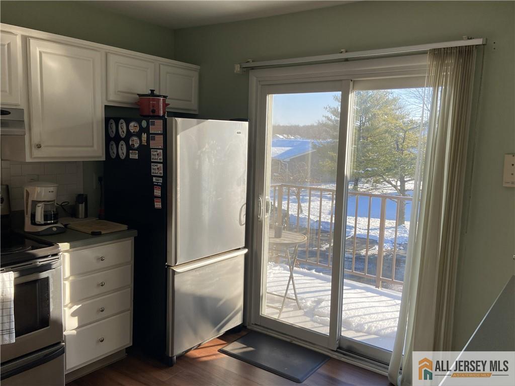 525 Belford Road, Unit O Monroe Township, NJ 08831 - Photo 8 of 19 a white refrigerator freezer and a stove sitting inside of a kitchen