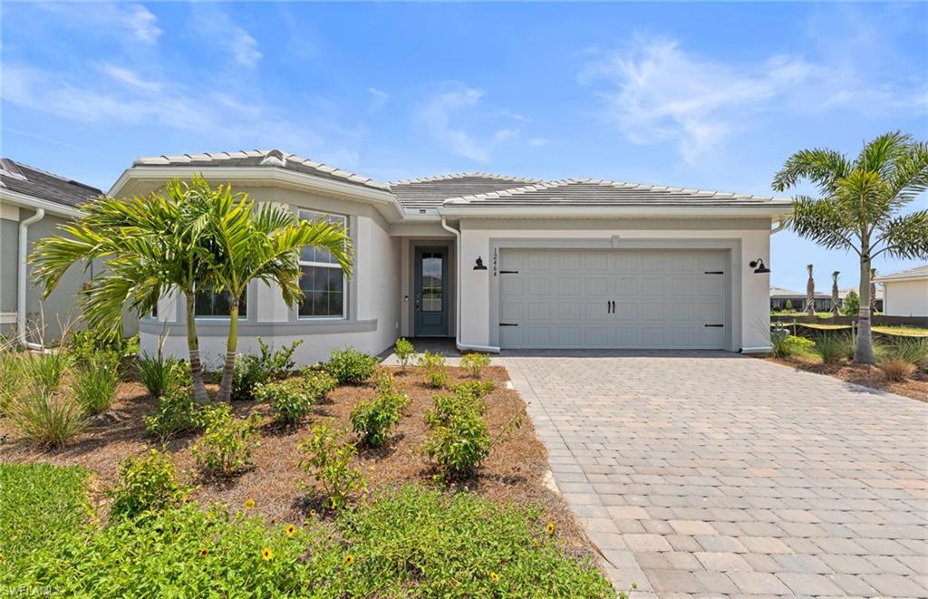 12464 Basalt Lane Alva, FL 33920 - Photo 1 of 28 a view of a house with a garage