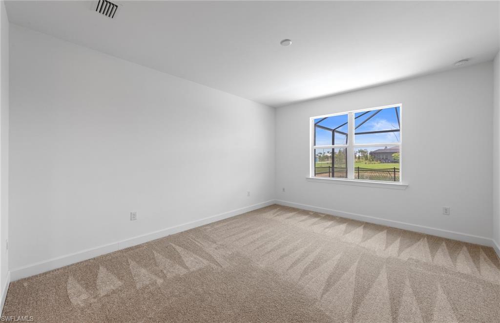 12464 Basalt Lane Alva, FL 33920 - Photo 12 of 28 an empty room with windows