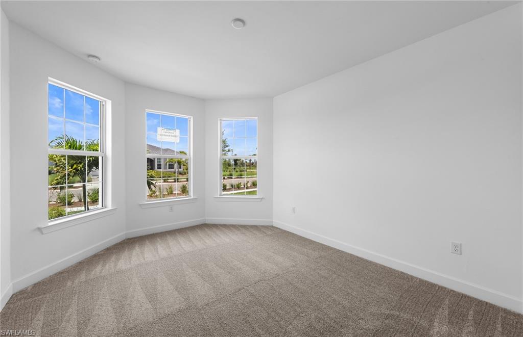 12464 Basalt Lane Alva, FL 33920 - Photo 18 of 28 a view of an empty room with a window