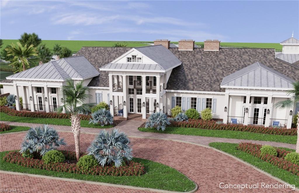 12464 Basalt Lane Alva, FL 33920 - Photo 26 of 28 a front view of a house with a garden