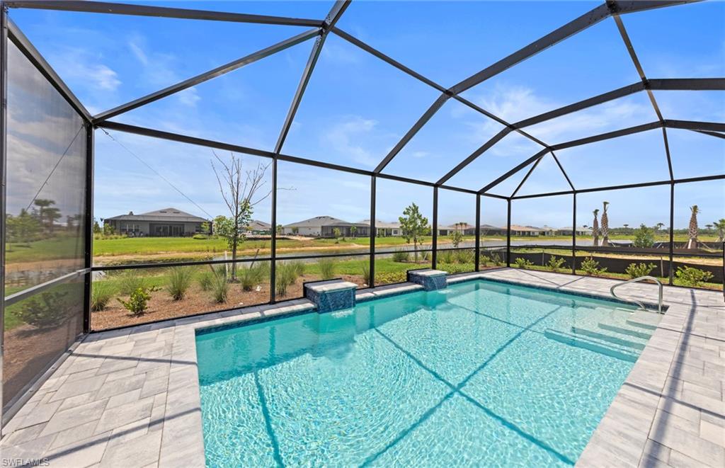 12464 Basalt Lane Alva, FL 33920 - Photo 4 of 28 a view of a swimming pool with an outdoor seating