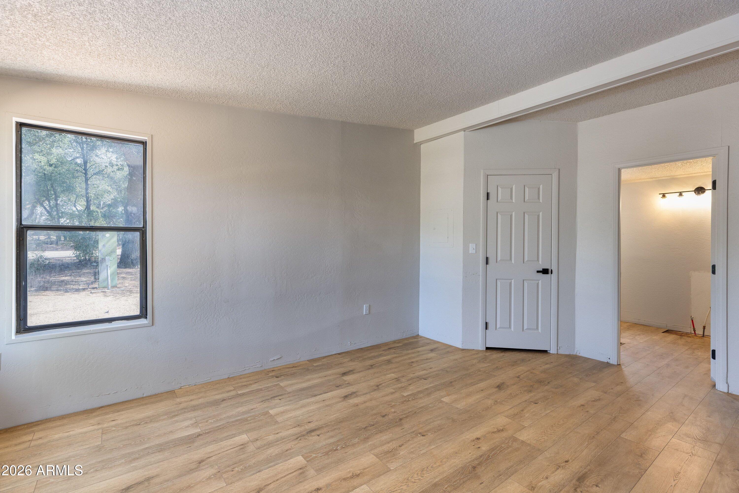 1302 North Matterhorn Road Payson, AZ 85541 - Photo 12 of 27 a view of an empty room with window and closet area