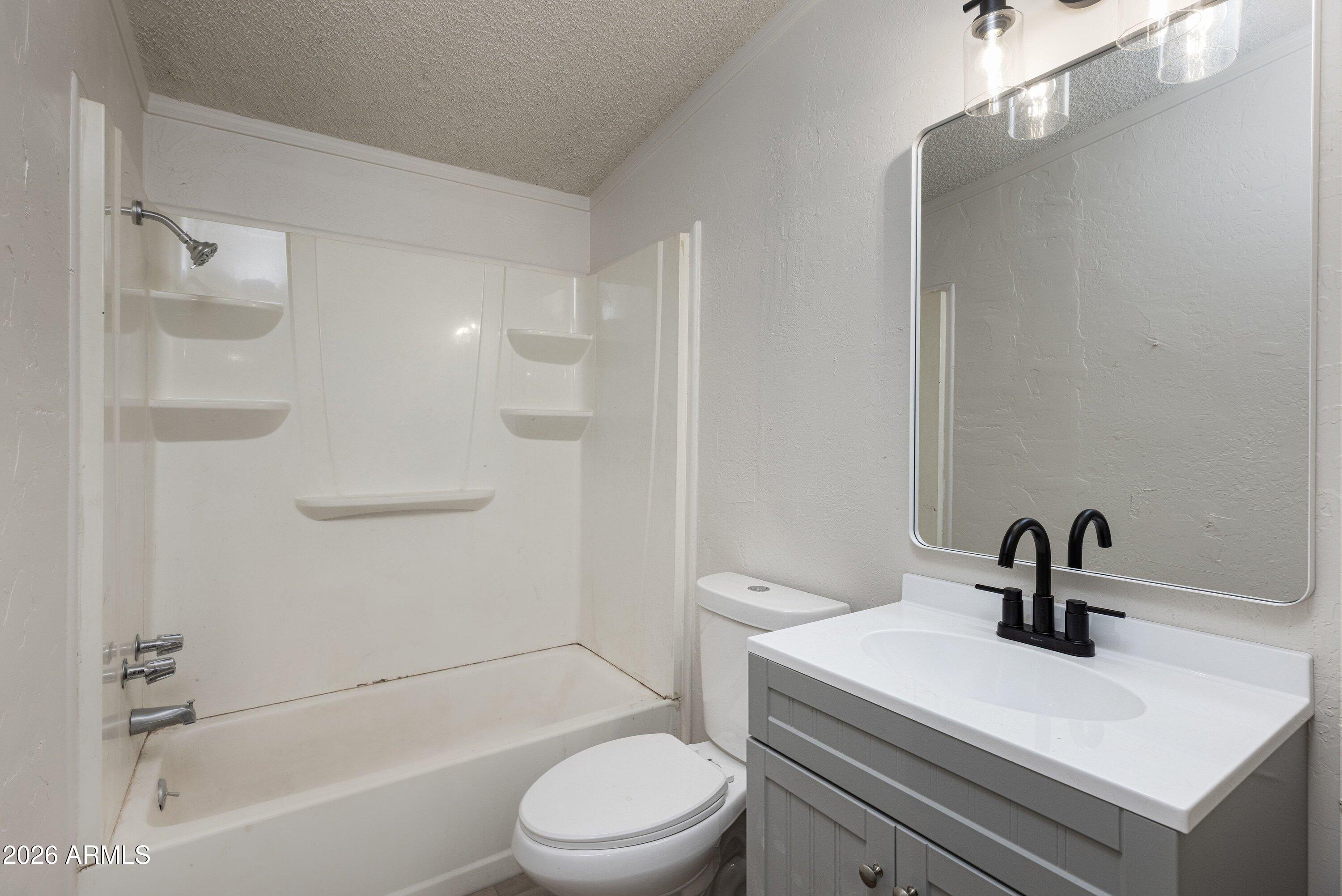 1302 North Matterhorn Road Payson, AZ 85541 - Photo 16 of 27 a bathroom with a sink a toilet and shower