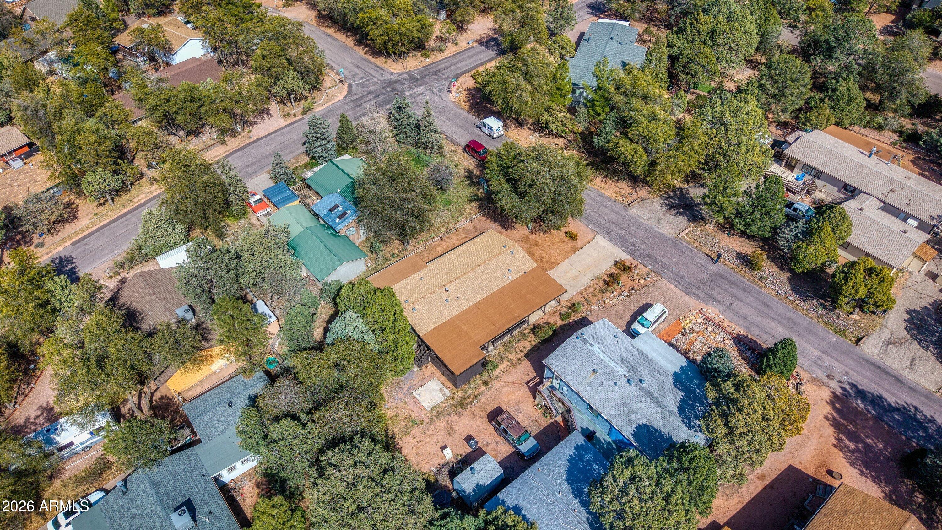 1302 North Matterhorn Road Payson, AZ 85541 - Photo 24 of 27 an aerial view of a house with a yard and parking spaces