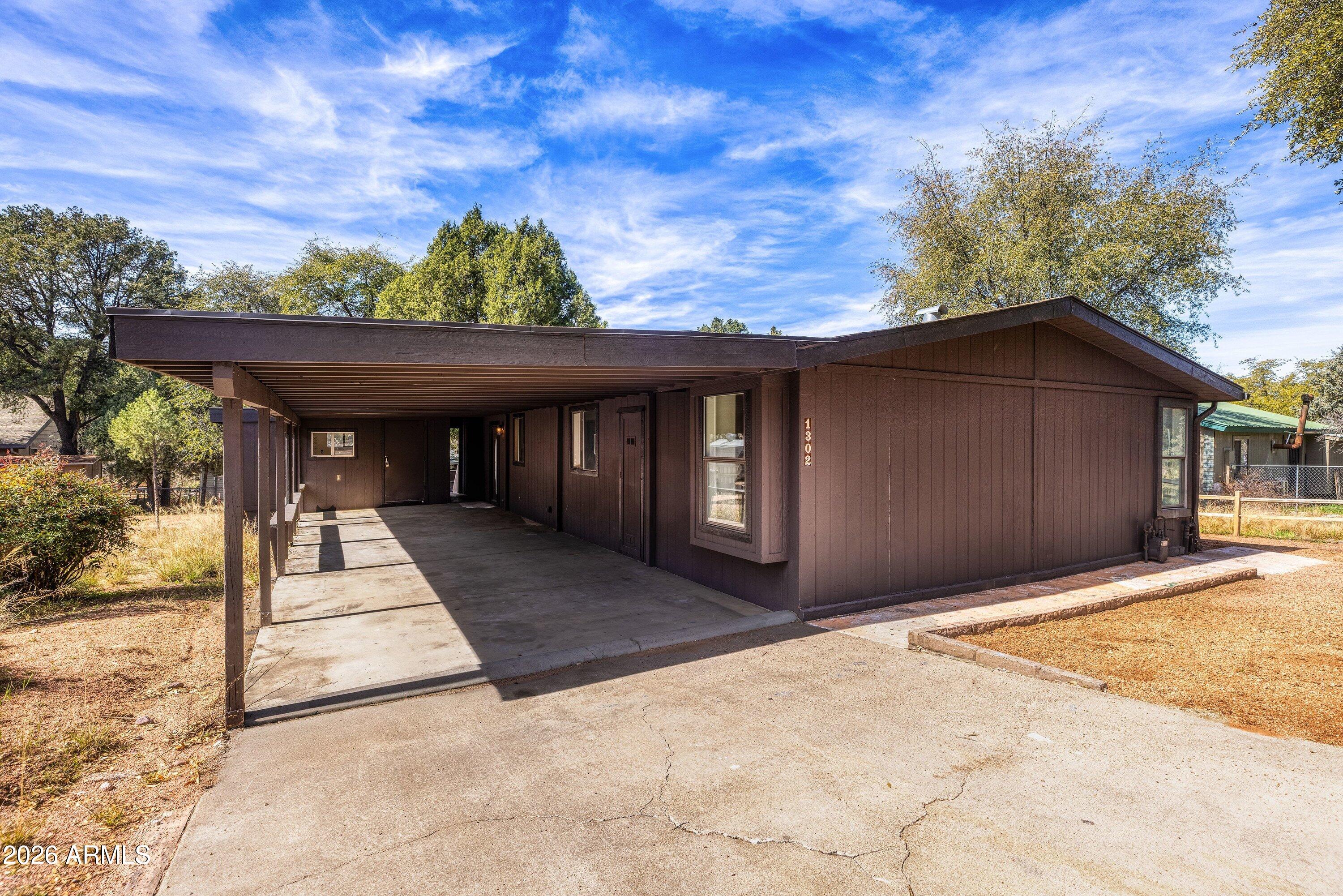1302 North Matterhorn Road Payson, AZ 85541 - Photo 5 of 27 a front view of a house with a yard