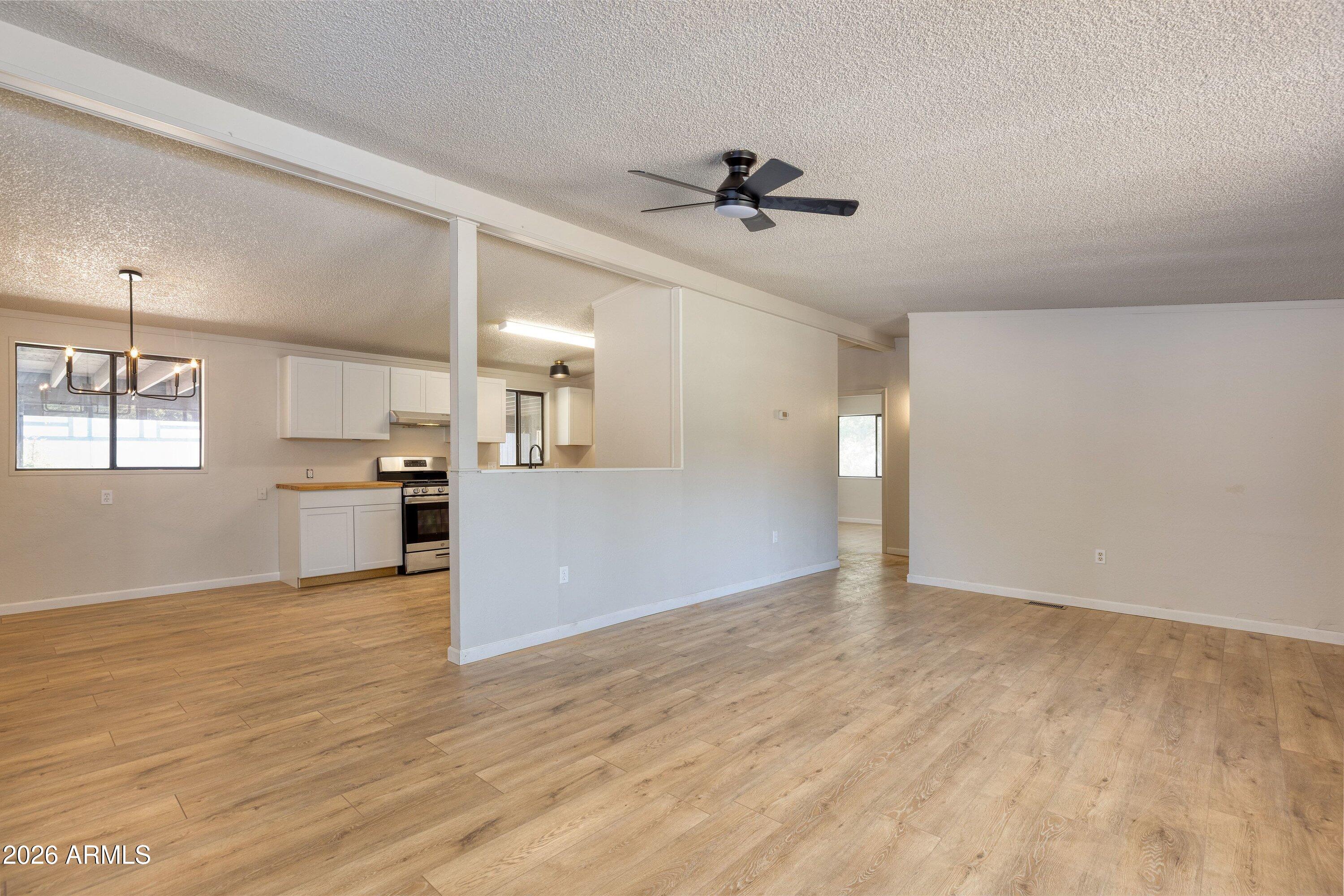 1302 North Matterhorn Road Payson, AZ 85541 - Photo 7 of 27 a view of a kitchen with a sink and wooden floor