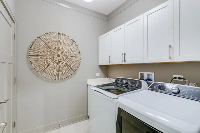 a kitchen with a sink a stove and cabinets