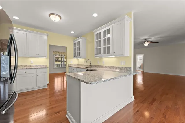 a view of kitchen with wooden floor