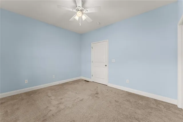 a view of a kitchen with a sink washer and dryer