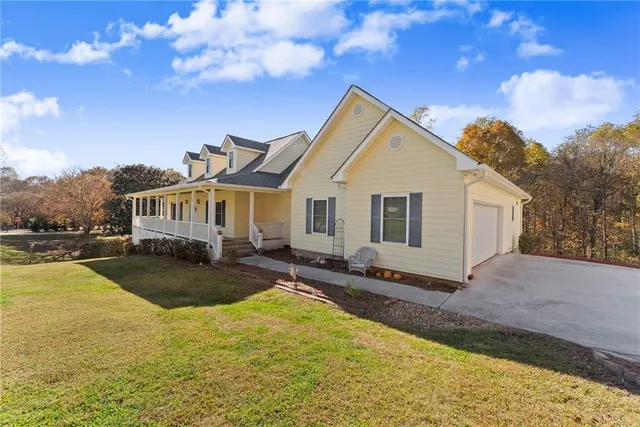 a front view of a house with swimming pool and porch