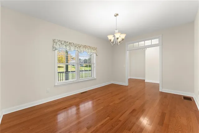 a kitchen with granite countertop cabinets and window