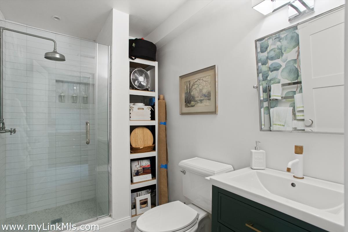 13 Parson Lane Nantucket, MA 02554 - Photo 22 of 44 a bathroom with a sink toilet and shower