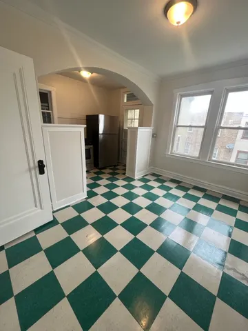 a view of a livingroom with a black and white checkered floor