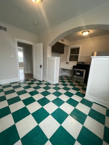 a view of a storage & utility room with a checkered floor