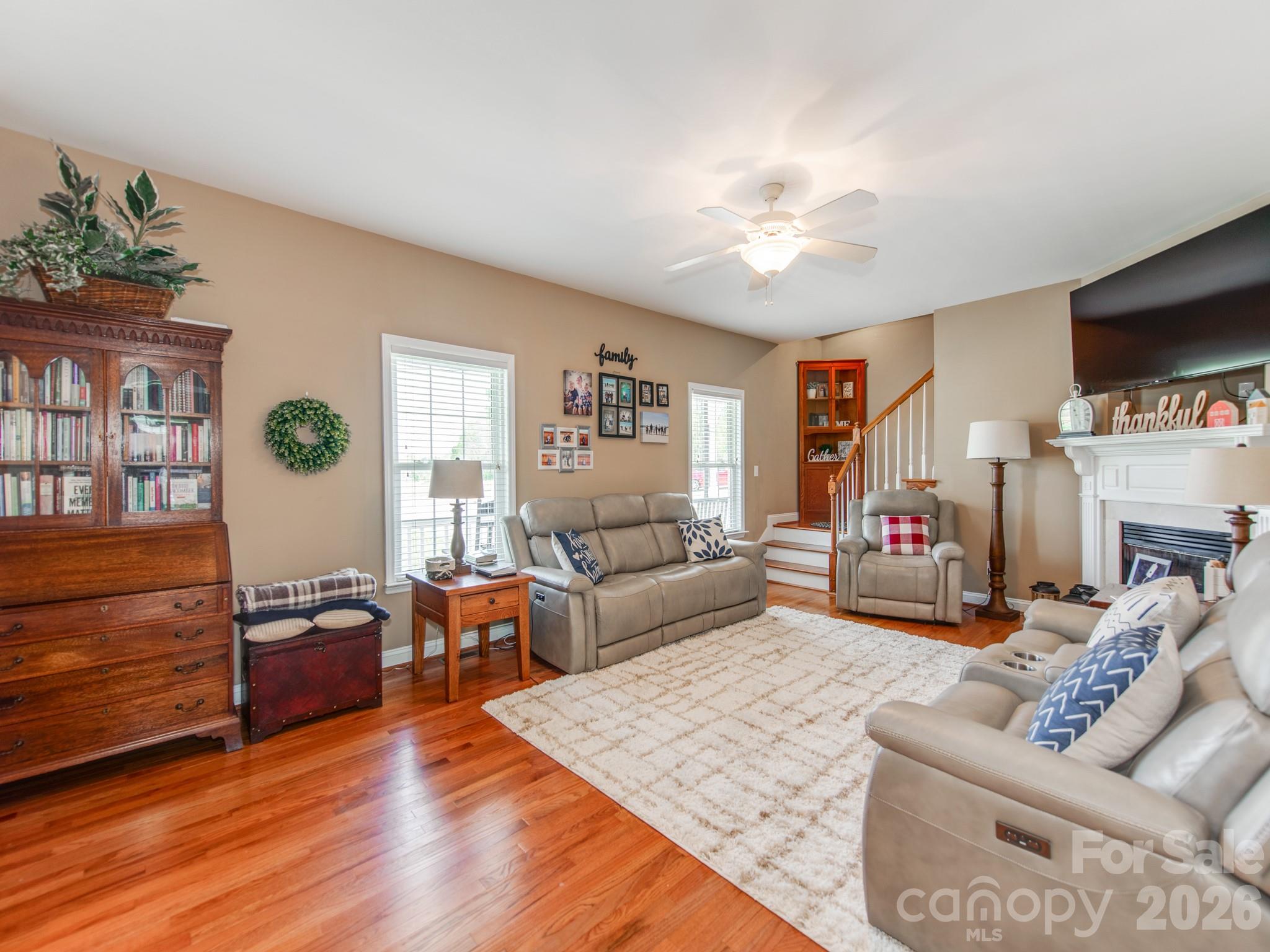 2261 Stallings Road Harrisburg, NC 28075 - Photo 11 of 41 a living room with furniture and a flat screen tv