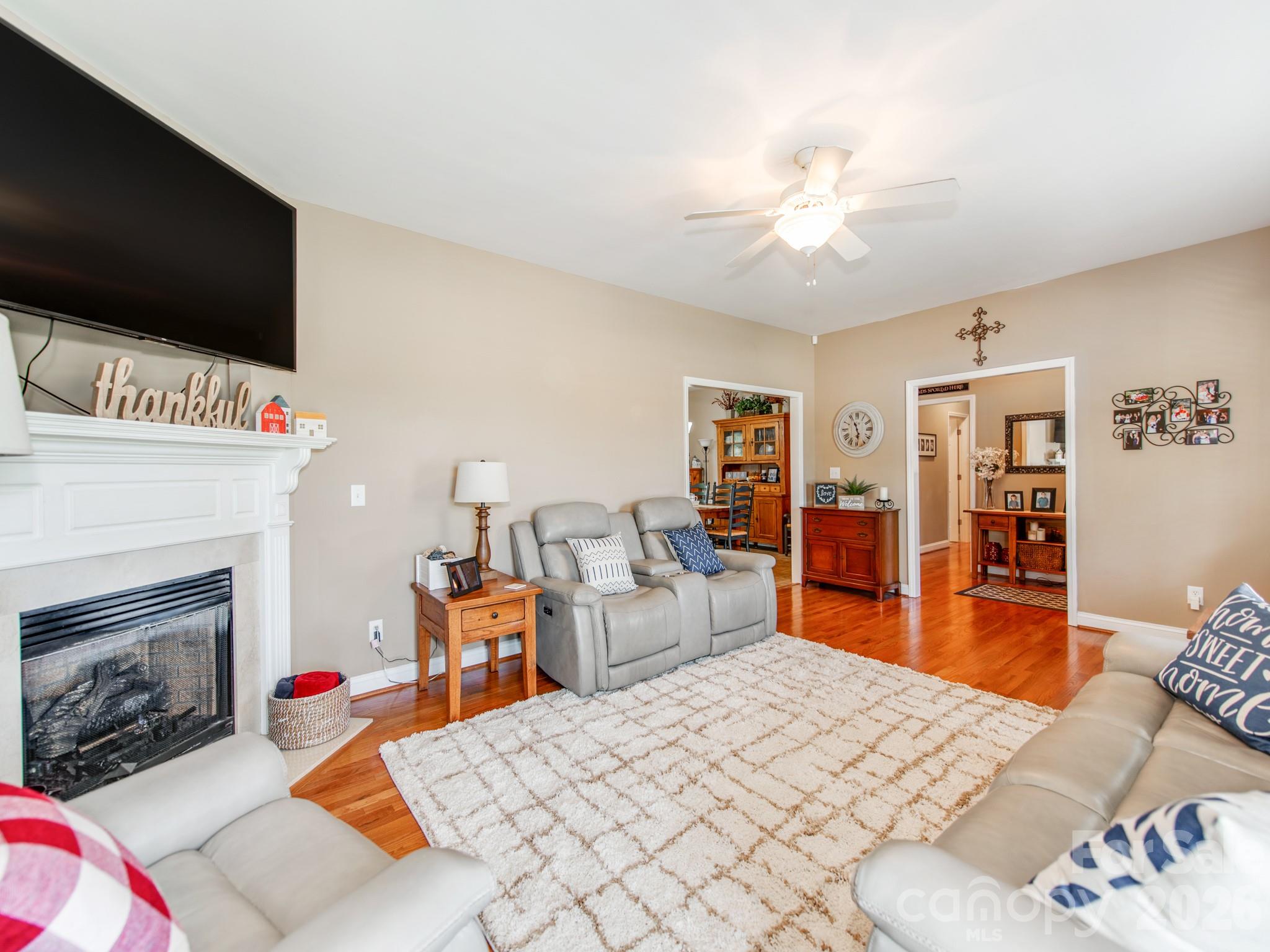 2261 Stallings Road Harrisburg, NC 28075 - Photo 12 of 41 a bedroom with a bed and a flat screen tv