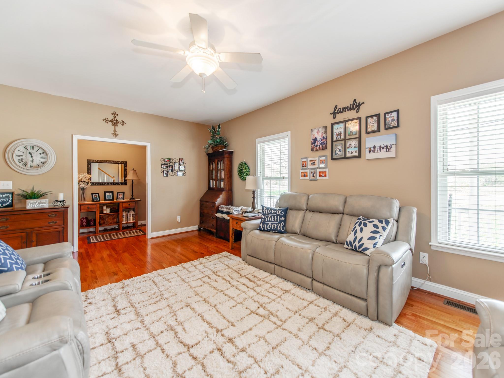 2261 Stallings Road Harrisburg, NC 28075 - Photo 13 of 41 a living room with furniture and a flat screen tv