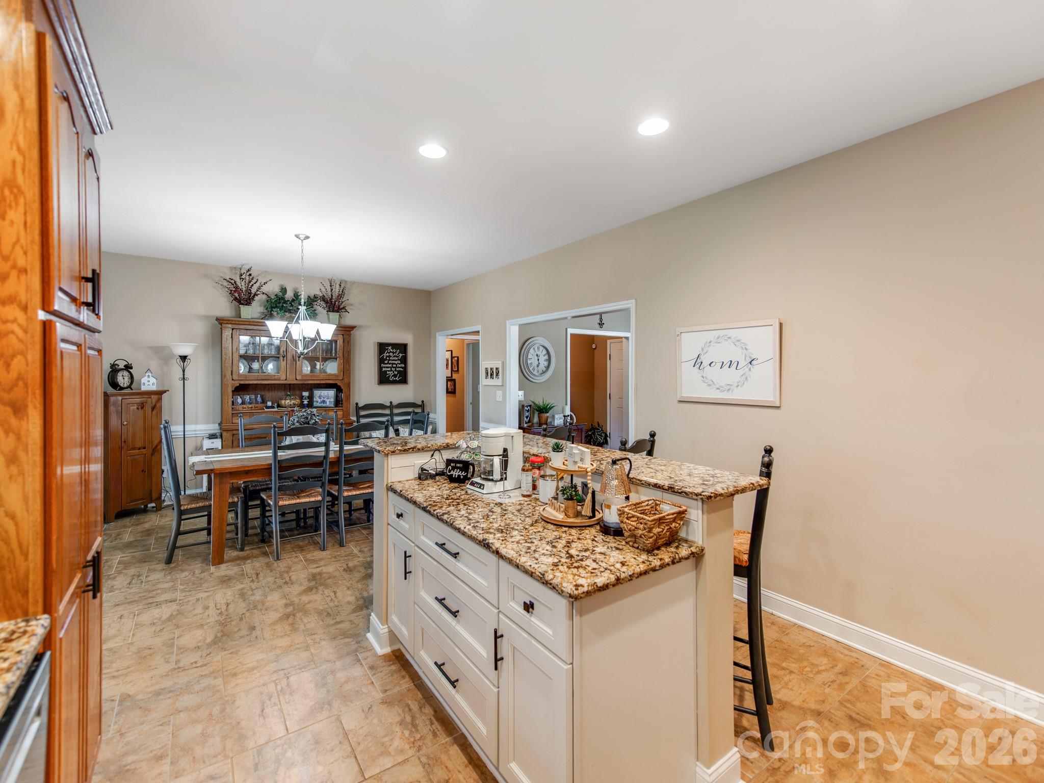 2261 Stallings Road Harrisburg, NC 28075 - Photo 17 of 41 a view of a dining room with furniture