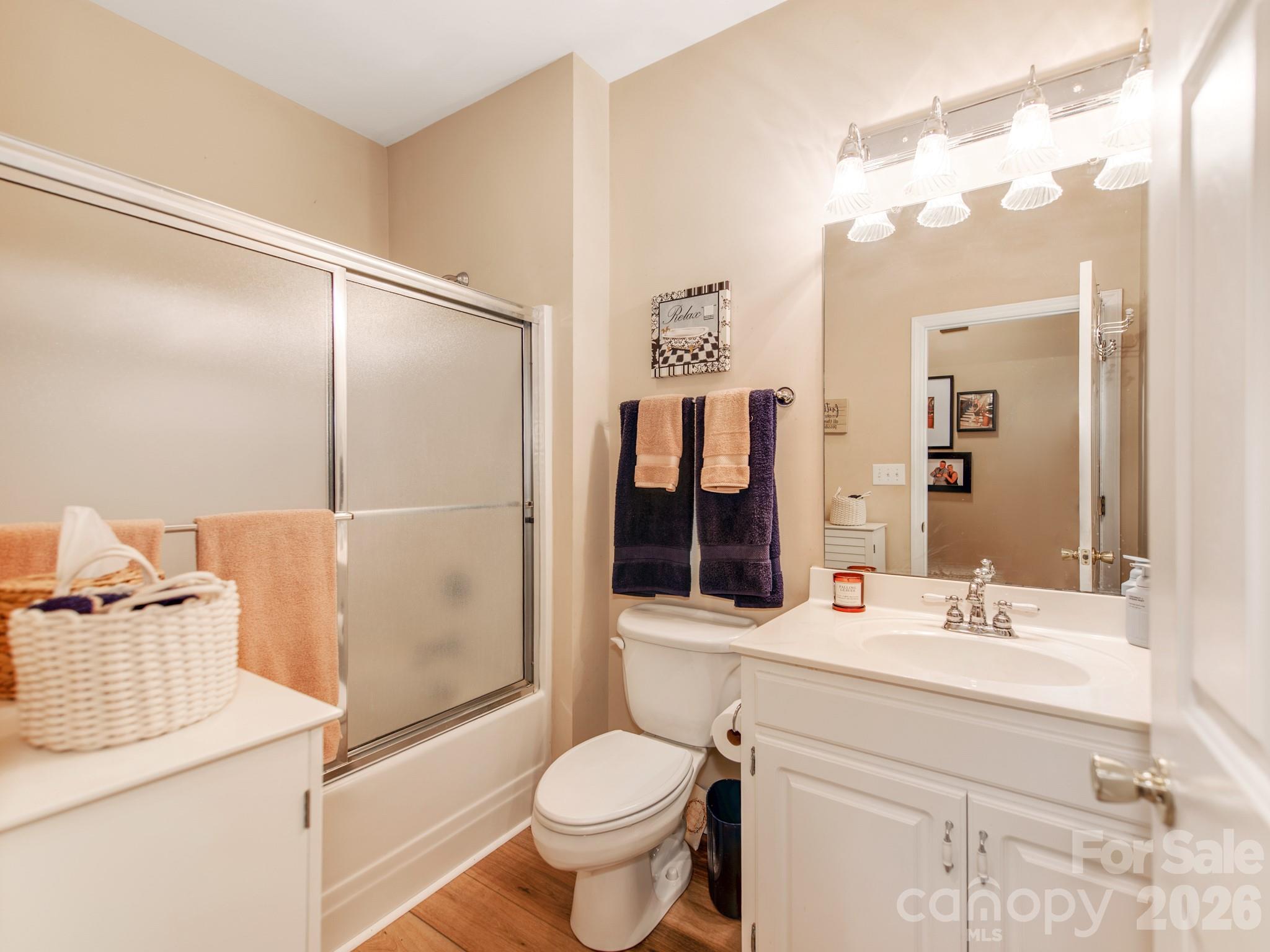 2261 Stallings Road Harrisburg, NC 28075 - Photo 29 of 41 a bathroom with a sink toilet and shower