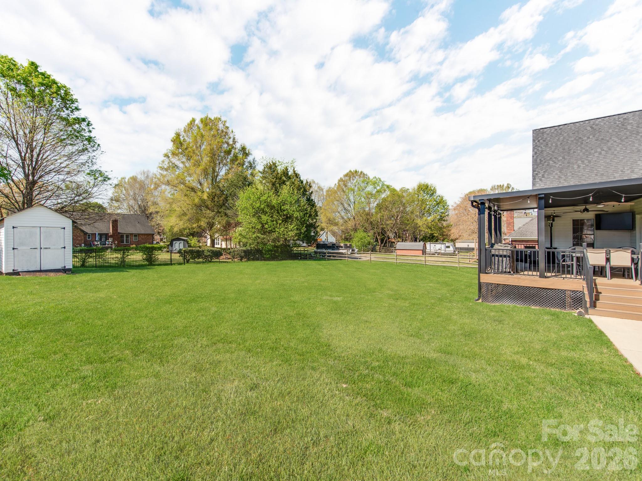 2261 Stallings Road Harrisburg, NC 28075 - Photo 39 of 41 a view of yard with swimming pool and green space