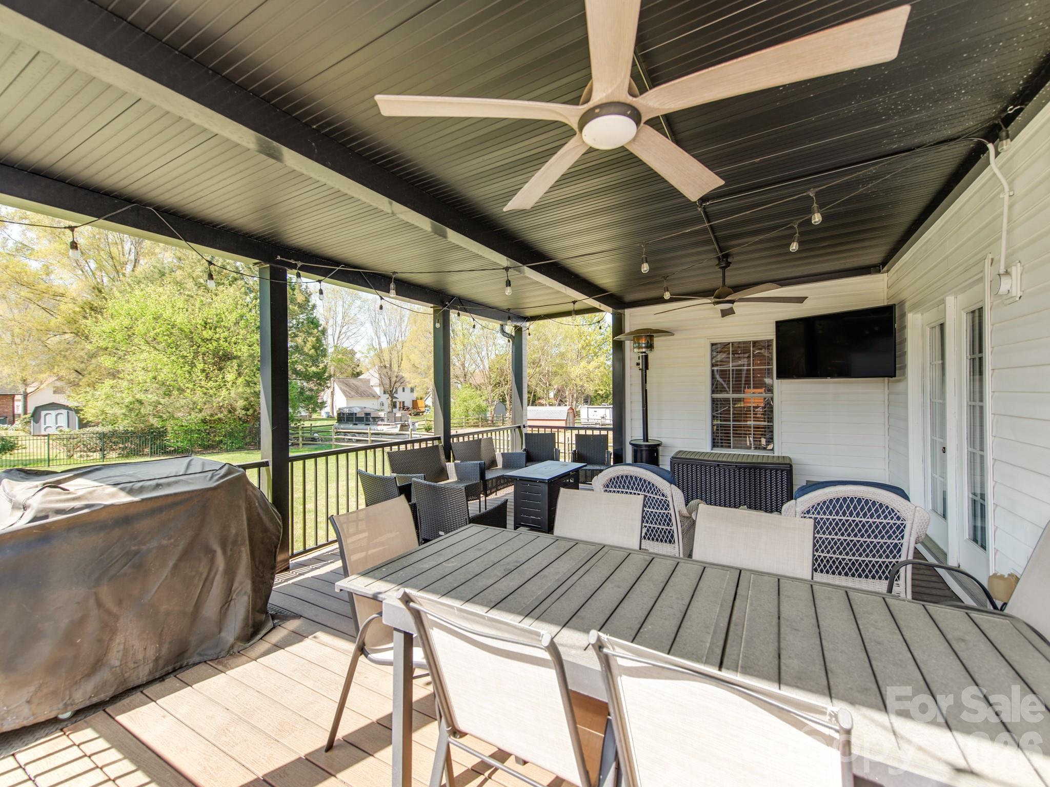 2261 Stallings Road Harrisburg, NC 28075 - Photo 5 of 41 a view of a patio with wooden floor