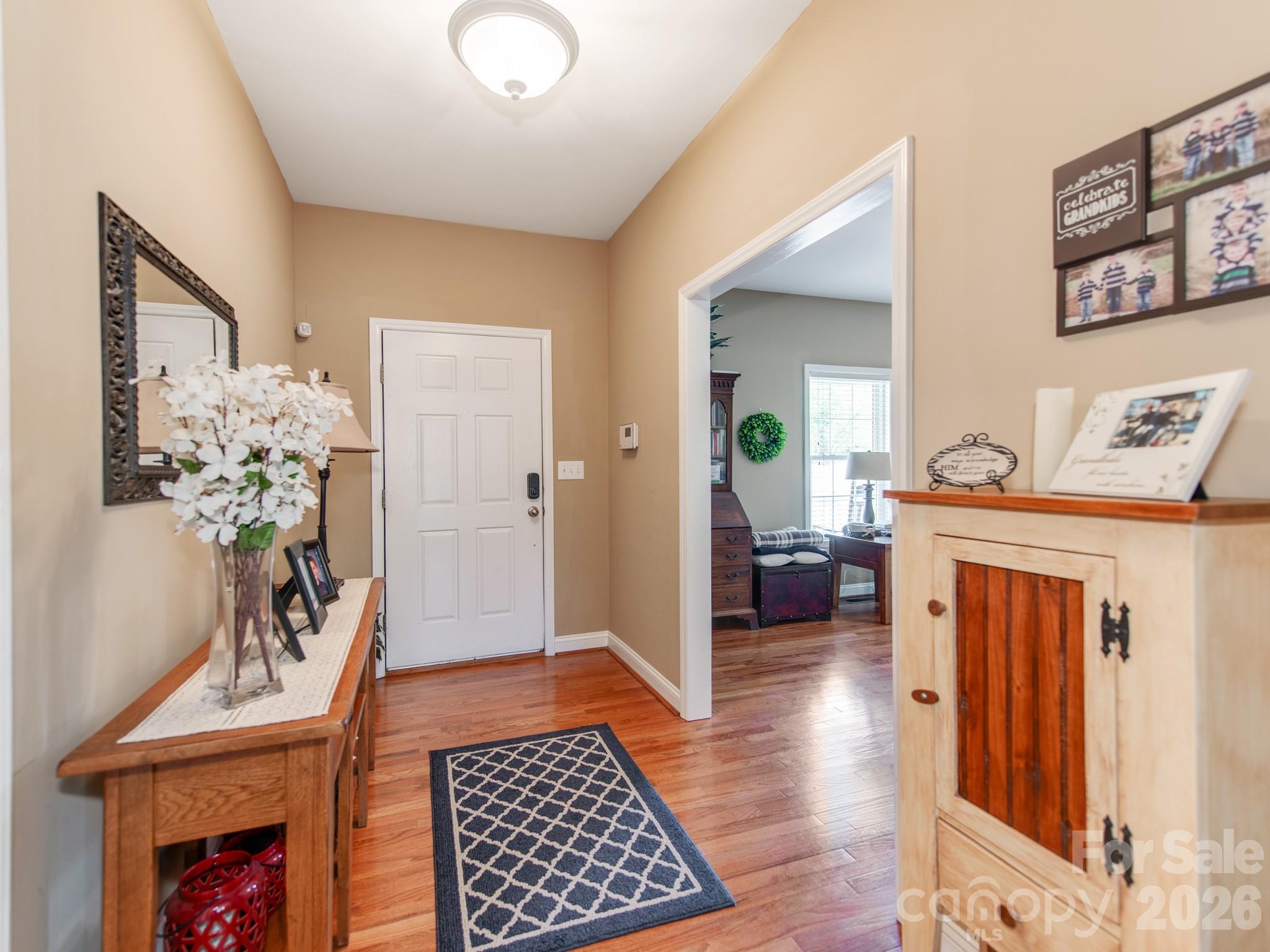 2261 Stallings Road Harrisburg, NC 28075 - Photo 10 of 41 a bedroom with furniture and a rug