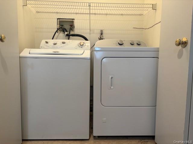 1 Spring Pond Drive Ossining, NY 10562 - Photo 15 of 17 a utility room with dryer and washer