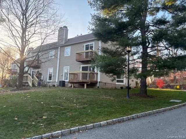 a view of a building with a yard