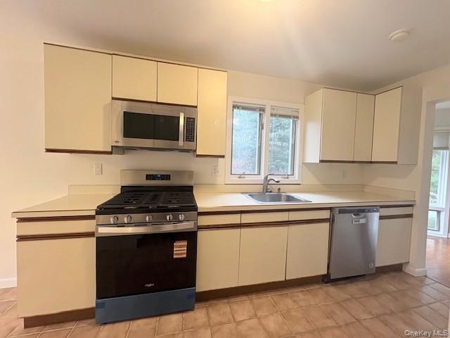 1 Spring Pond Drive Ossining, NY 10562 - Photo 4 of 17 a kitchen with a stove and a sink