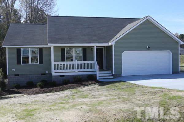 100 Hunters Point Court Angier, NC 27501 - Photo 1 of 13 a front view of a house with a yard